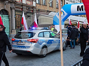 Wroclaw, Poland - November 11 2019: Police cars parked near finish line of Wroclaw Independence Run WrocÃâawski Bieg NiepodlegÃâo